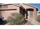 Charming single-story home with a stucco facade, arched entryway, and a well-manicured front yard at 10220 Arlington Abby St, Las Vegas, NV 89183