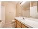 Bright bathroom features tiled floors, a wooden vanity with white countertops, plus a shower and tub at 1050 E Cactus Ave # 1128, Las Vegas, NV 89183