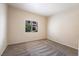 Bedroom featuring carpet, light walls, and a window that allows natural light into the room at 1050 E Cactus Ave # 1128, Las Vegas, NV 89183