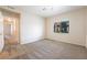 Spacious bedroom with neutral carpeting, light walls, a ceiling fan, and a large window that provides natural light at 1050 E Cactus Ave # 1128, Las Vegas, NV 89183
