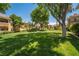 Serene community green space with mature trees providing ample shade at 1050 E Cactus Ave # 1128, Las Vegas, NV 89183