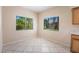 Bright dining area features tiled floors, neutral walls, and dual windows that offer views of the lush outdoors at 1050 E Cactus Ave # 1128, Las Vegas, NV 89183