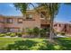 Beautiful condo building with well-maintained landscaping and a lush lawn at 1050 E Cactus Ave # 1128, Las Vegas, NV 89183