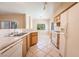 Well-lit kitchen with tile floors, ample cabinets, and bright natural light at 1050 E Cactus Ave # 1128, Las Vegas, NV 89183