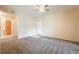 Spacious living room with neutral carpet, fresh paint, and ample natural light at 1050 E Cactus Ave # 1128, Las Vegas, NV 89183