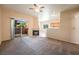 Inviting living room featuring plush carpeting, fireplace, and sliding glass doors at 1050 E Cactus Ave # 1128, Las Vegas, NV 89183