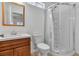 Bright bathroom featuring a glass shower, a stylish sink with cabinets and a framed mirror at 1158 E Hacienda Ave, Las Vegas, NV 89119