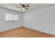 Bedroom with hardwood floors, ceiling fan, and natural light from the window at 1158 E Hacienda Ave, Las Vegas, NV 89119