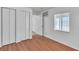 Bedroom featuring closet, wood floors, air conditioning, and a bright window at 1158 E Hacienda Ave, Las Vegas, NV 89119