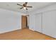 Bright bedroom with hardwood floors, ceiling fan, and closet at 1158 E Hacienda Ave, Las Vegas, NV 89119