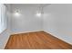 Bright bedroom featuring hardwood floors and ample natural light from a window at 1158 E Hacienda Ave, Las Vegas, NV 89119