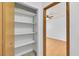 Walk-in closet with custom shelving, providing ample storage space and organization at 1158 E Hacienda Ave, Las Vegas, NV 89119