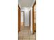 Hallway featuring tile floors and access to other rooms, including a bathroom at 1158 E Hacienda Ave, Las Vegas, NV 89119