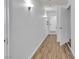 Hallway with laminate flooring and decorative wall sconces at 1158 E Hacienda Ave, Las Vegas, NV 89119