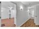 Bright hallway leading to living area with hardwood floors at 1158 E Hacienda Ave, Las Vegas, NV 89119