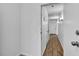 Hallway featuring hardwood floors, white walls, and recessed lighting at 1158 E Hacienda Ave, Las Vegas, NV 89119