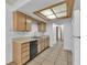 Well-organized kitchen with light wood cabinets and modern appliances, ideal for home cooking at 1158 E Hacienda Ave, Las Vegas, NV 89119