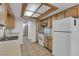 Functional kitchen with wood cabinets, modern appliances and great storage options for efficient meal prep at 1158 E Hacienda Ave, Las Vegas, NV 89119