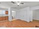 Spacious living area features hardwood flooring and kitchenette at 1158 E Hacienda Ave, Las Vegas, NV 89119
