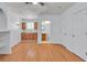 Open living space with wood laminate flooring, kitchenette, and bath at 1158 E Hacienda Ave, Las Vegas, NV 89119