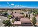 Expansive desert home featuring an attached three-car garage, detached garage, and mature landscaping at 1182 Thomas Bay Cir, Logandale, NV 89021