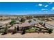 Aerial view showcasing a home with a lush backyard, mature trees, and manicured landscaping at 1182 Thomas Bay Cir, Logandale, NV 89021