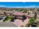 A sprawling desert home with an attached three-car garage, detached garage, and lush, mature landscaping at 1182 Thomas Bay Cir, Logandale, NV 89021