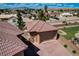 Aerial view of large garage with lush landscaped yard and tiled roof at 1182 Thomas Bay Cir, Logandale, NV 89021