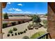 Aerial view of backyard, featuring a fire pit, patio, and mature landscaping at 1182 Thomas Bay Cir, Logandale, NV 89021