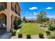 Landscaped backyard with mature trees and manicured lawn offers a tranquil and inviting outdoor space at 1182 Thomas Bay Cir, Logandale, NV 89021