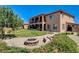 Large backyard includes a grass area, low-maintenance landscaping, and a charming fire pit at 1182 Thomas Bay Cir, Logandale, NV 89021