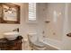 The bathroom has a vessel sink, a black countertop, and a shower-tub combination at 1182 Thomas Bay Cir, Logandale, NV 89021