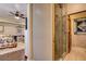 Bathroom featuring tiled shower and bedroom view with ceiling fan at 1182 Thomas Bay Cir, Logandale, NV 89021