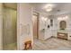 Bright bathroom featuring a walk-in shower and a vanity with beautiful marble countertops at 1182 Thomas Bay Cir, Logandale, NV 89021