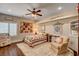 Inviting bedroom with a ceiling fan, area rug and lots of natural light at 1182 Thomas Bay Cir, Logandale, NV 89021