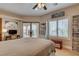 Bedroom with ceiling fan, work space, and french doors to the outside at 1182 Thomas Bay Cir, Logandale, NV 89021