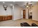 A spacious bonus room features a wet bar with wood cabinets and hardware floors, and a leather chair at 1182 Thomas Bay Cir, Logandale, NV 89021