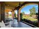 Covered patio overlooking landscaped backyard, offering a comfortable outdoor living space at 1182 Thomas Bay Cir, Logandale, NV 89021