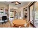 Inviting dining area with wood table, chairs, built-in shelves, and sliding glass door to the outdoor patio at 1182 Thomas Bay Cir, Logandale, NV 89021