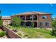 Elegant home with a lush green lawn, multi-level patio and manicured landscaping at 1182 Thomas Bay Cir, Logandale, NV 89021