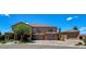Spacious two-story home featuring a three-car garage and professionally landscaped front yard at 1182 Thomas Bay Cir, Logandale, NV 89021