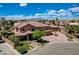 Spacious two-story home featuring a large driveway, mature trees, and an attached three-car garage at 1182 Thomas Bay Cir, Logandale, NV 89021