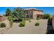 The exterior of this home features low maintenance landscaping, a large yard, and a private setting at 1182 Thomas Bay Cir, Logandale, NV 89021