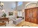 Welcoming home foyer boasts soaring ceilings, tiled floors, and a double door entry at 1182 Thomas Bay Cir, Logandale, NV 89021