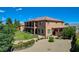 Stately home with a well-manicured lawn, fire pit, and inviting landscaping at 1182 Thomas Bay Cir, Logandale, NV 89021