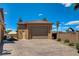 Detached two-car garage featuring a wide driveway, desert landscaping, and neutral color scheme at 1182 Thomas Bay Cir, Logandale, NV 89021