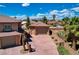 Detached garage with extended driveway and mature landscaping with a play area in the backyard at 1182 Thomas Bay Cir, Logandale, NV 89021