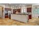 Gourmet kitchen boasts custom cabinets, granite countertops, and modern appliances at 1182 Thomas Bay Cir, Logandale, NV 89021
