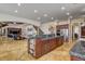 Gourmet kitchen with granite countertops and a view of the staircase and living space at 1182 Thomas Bay Cir, Logandale, NV 89021