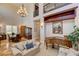 Elegant living room with a high ceiling, piano, and dining area at 1182 Thomas Bay Cir, Logandale, NV 89021